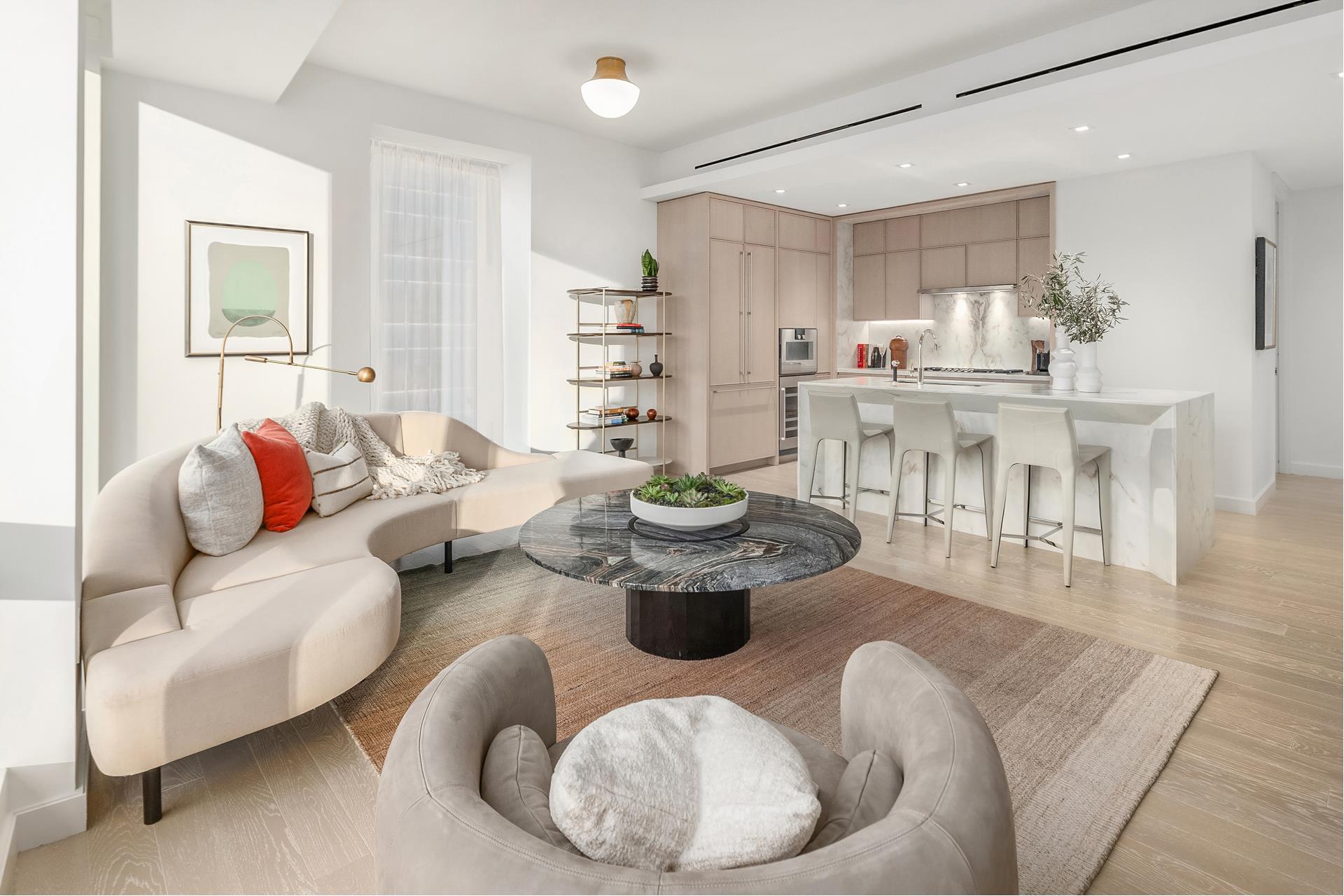 a living room with furniture and a dining table