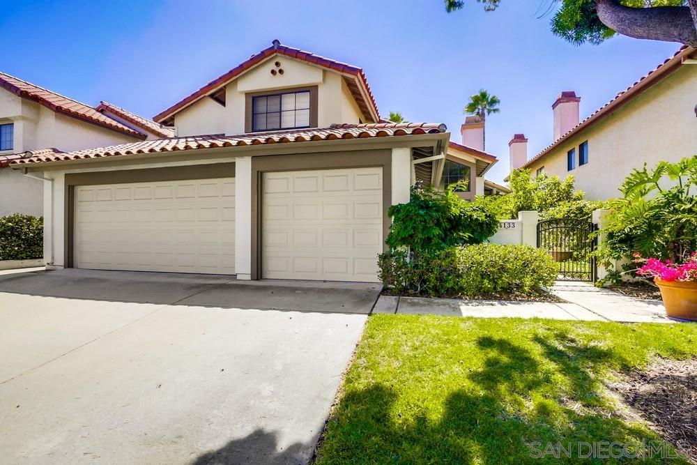 front view of a house with a small yard