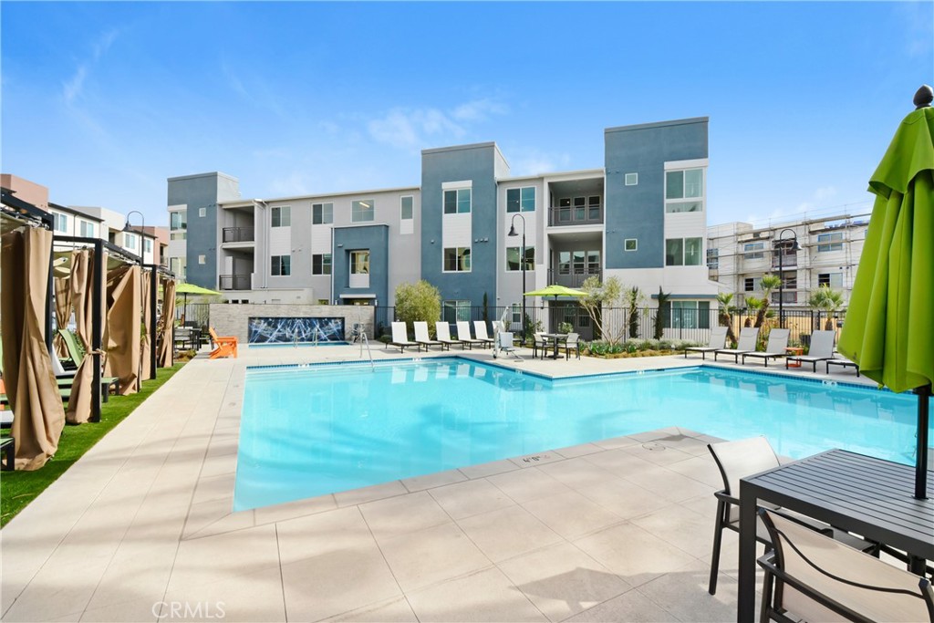 a view of swimming pool with outdoor seating