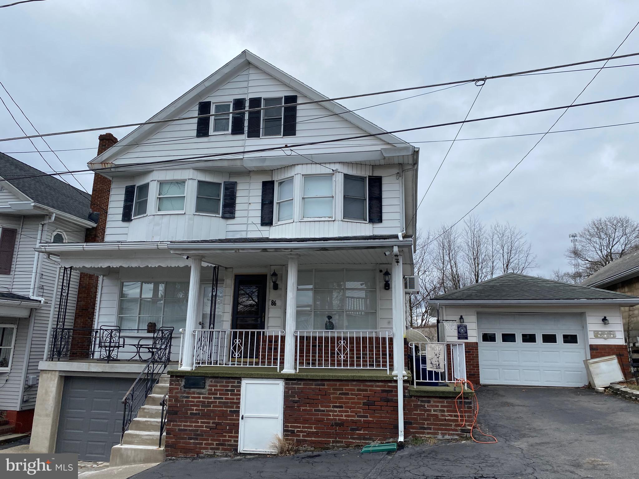 a front view of a house with a porch