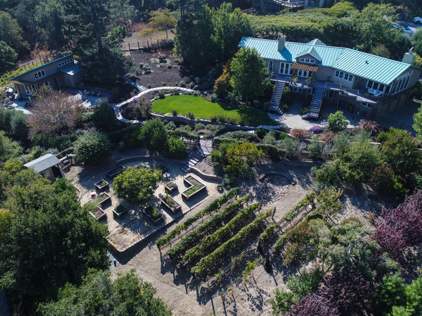 an aerial view of a house swimming pool patio and outdoor seating