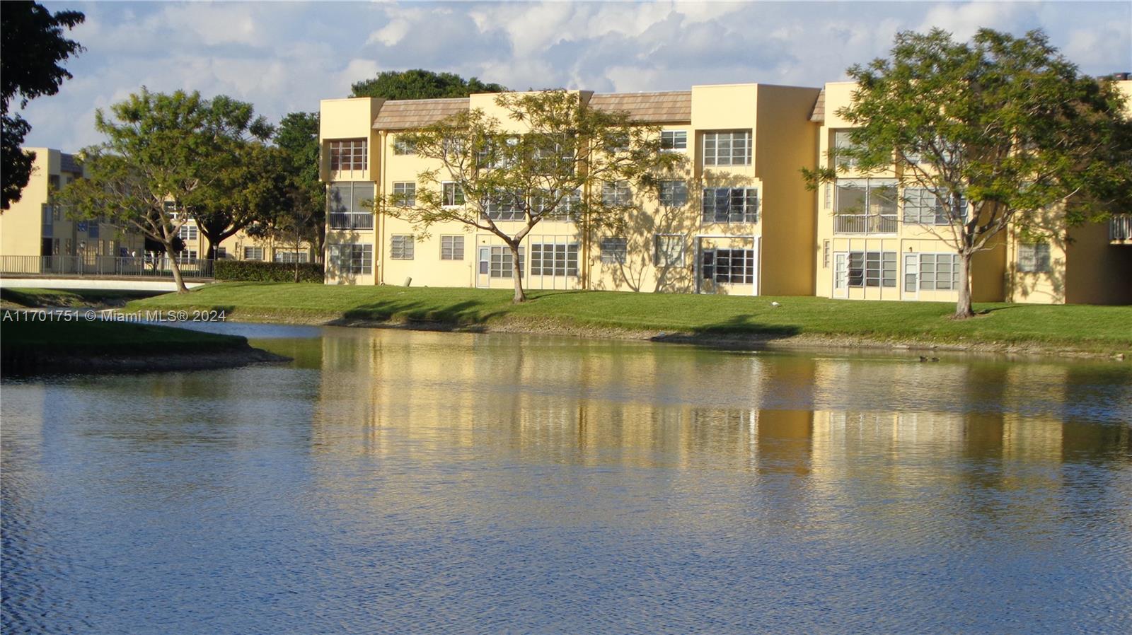 a view of a lake with a building in the background