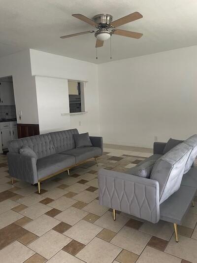 a living room with furniture and a rug