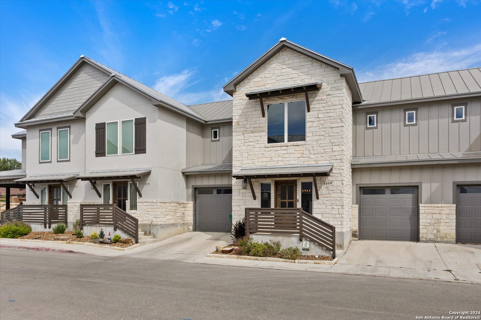 a front view of a house with garage