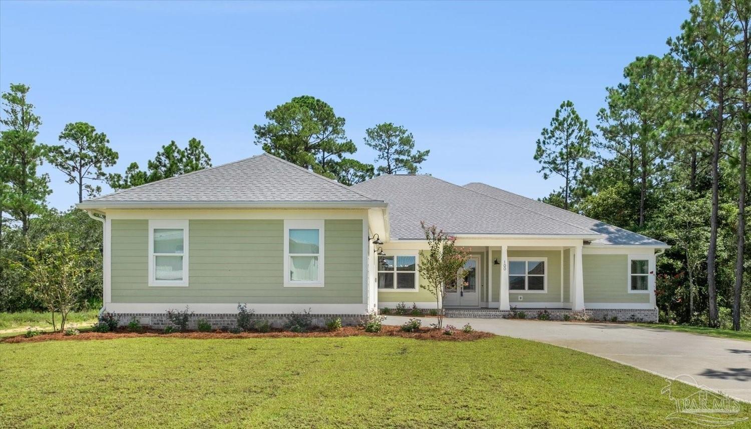 front view of a house with a yard