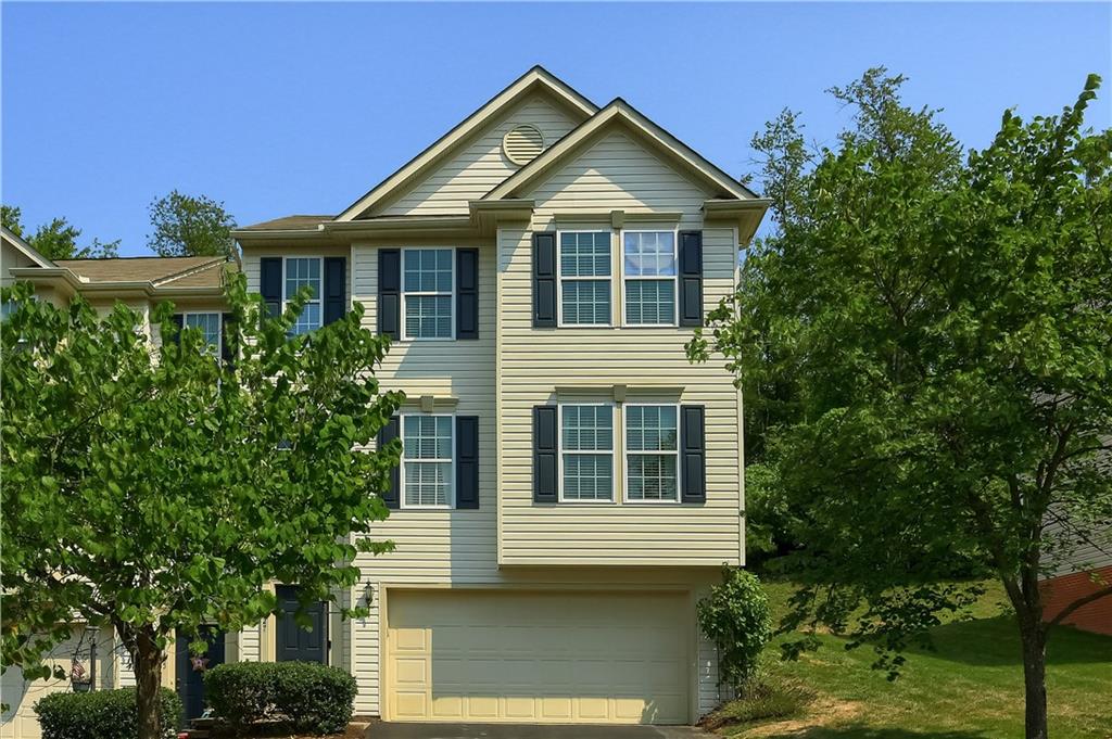 Front of townhouse.  End unit.  Grass, roof replacement, some painting and driveway sealing included.