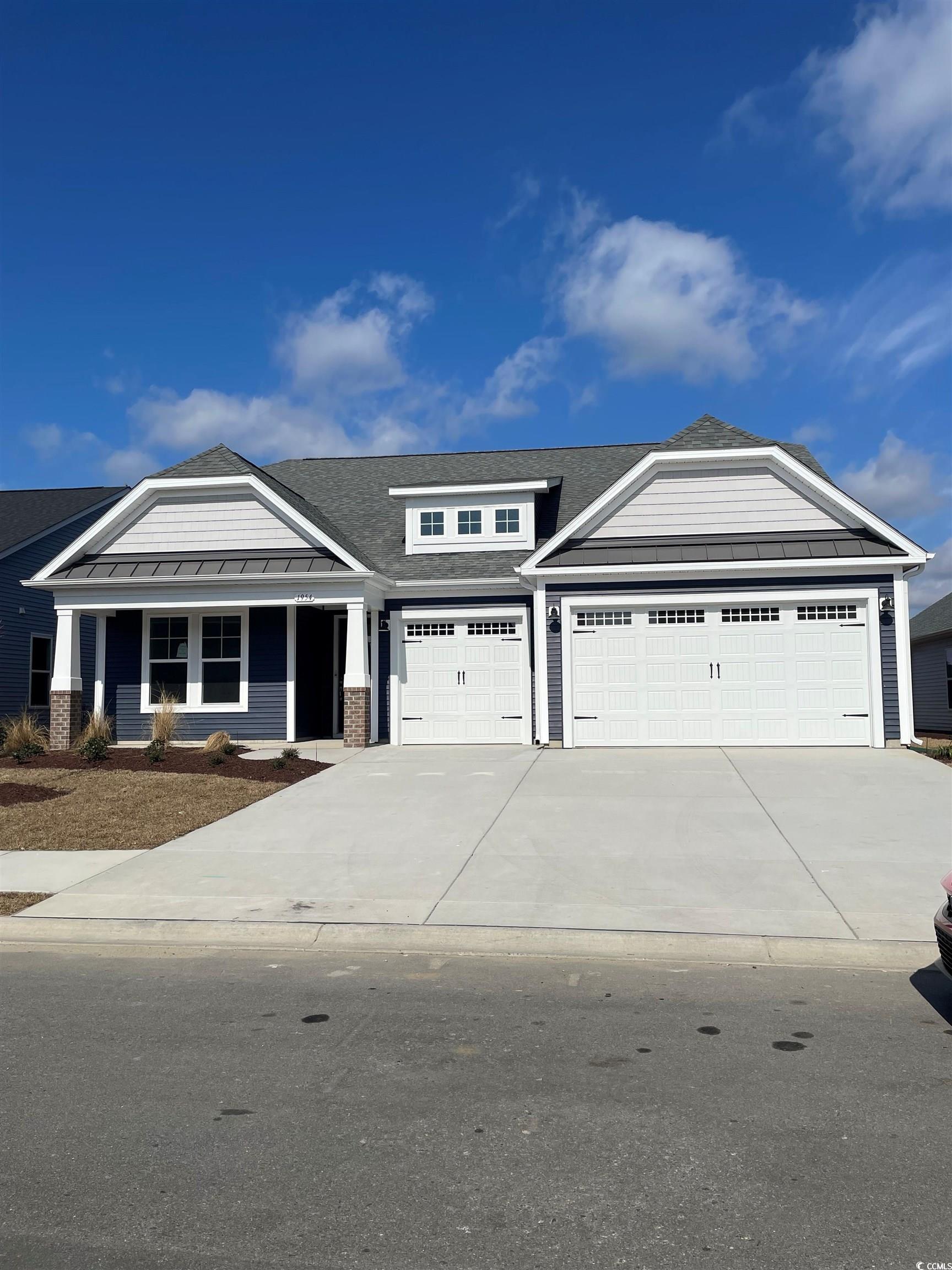 Craftsman-style house featuring a garage