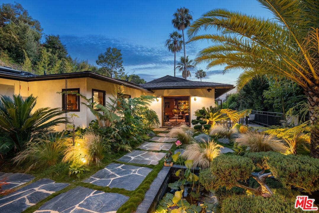 a view of a pathway with a backyard