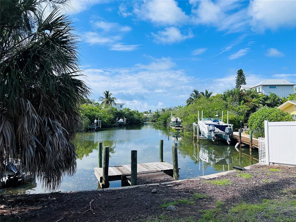 a view of a lake with a yard