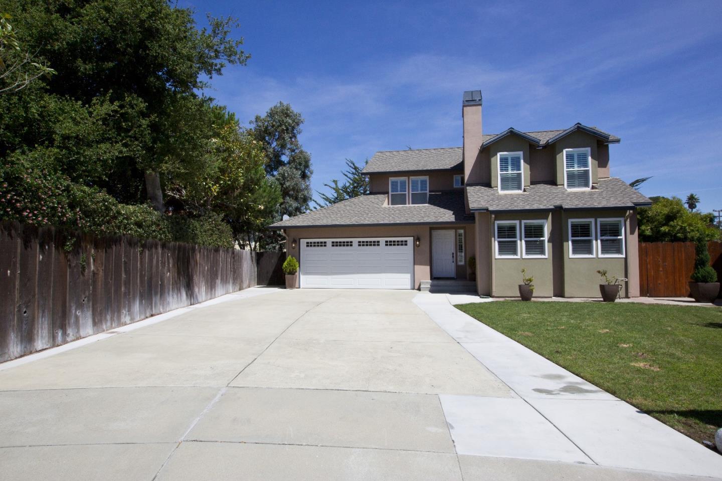 front view of a house with a garden