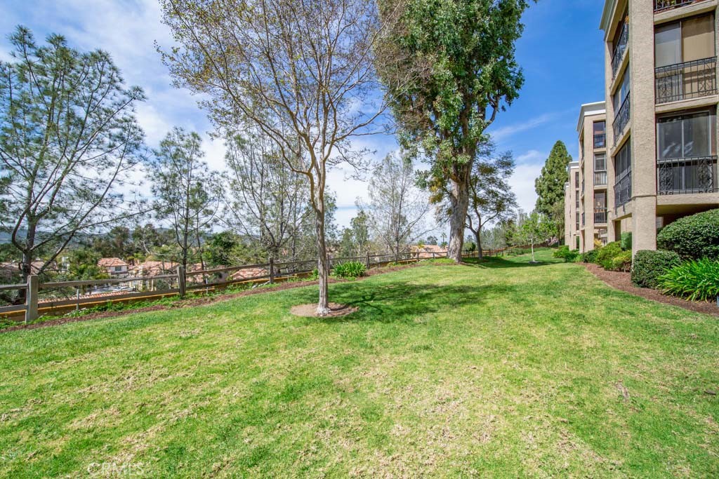 a view of a tree in front of a house