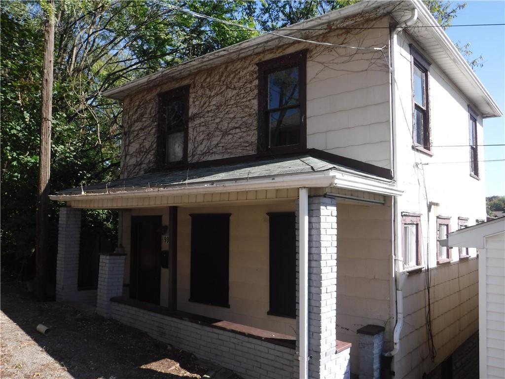 a front view of a house with garage