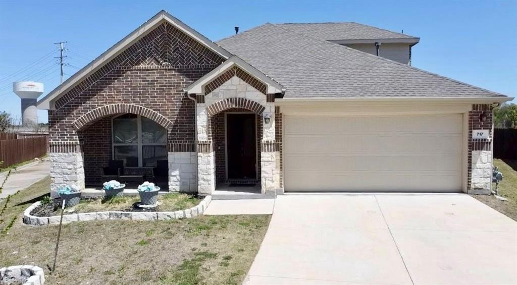 a front view of a house with yard