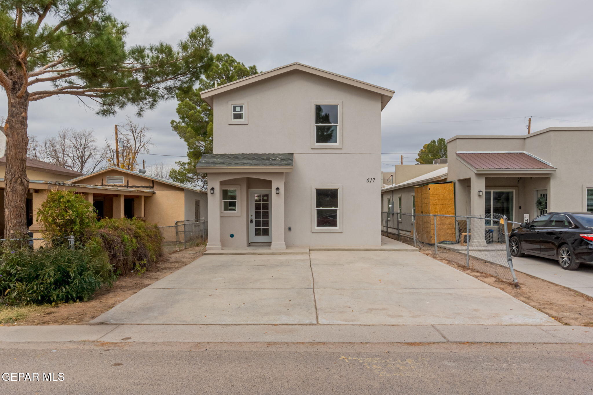 a view of house with yard and entertaining space