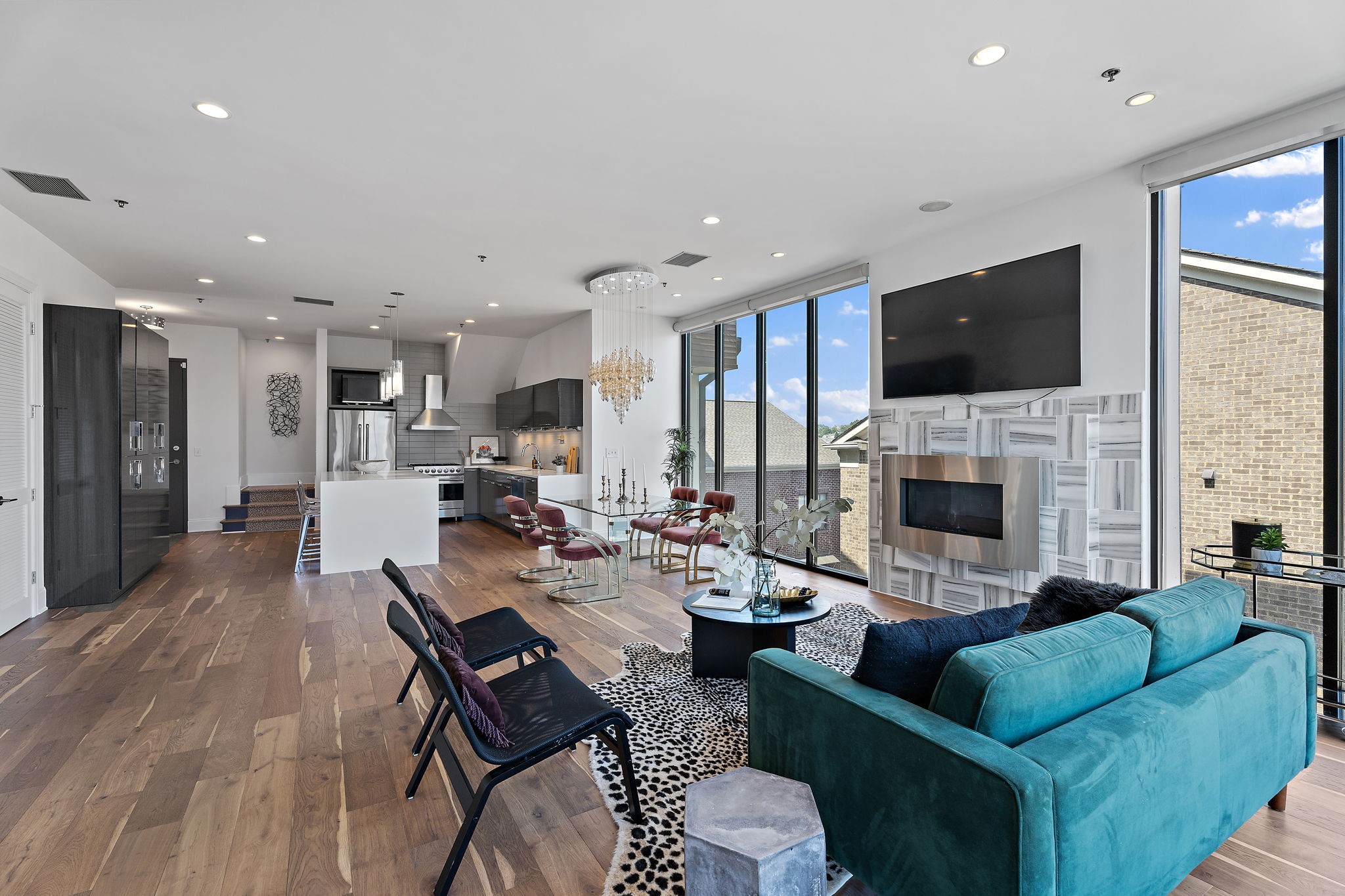 a living room with fireplace furniture and a flat screen tv