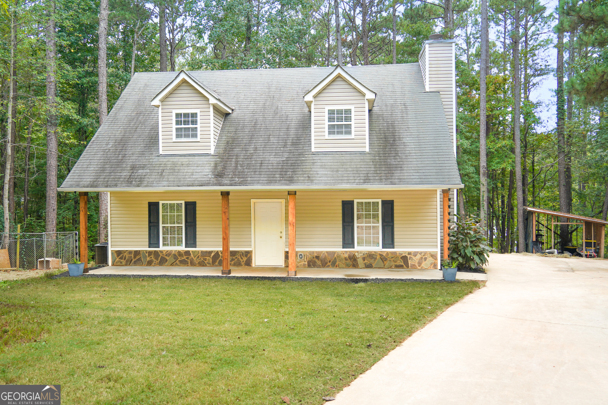 a front view of a house with garden