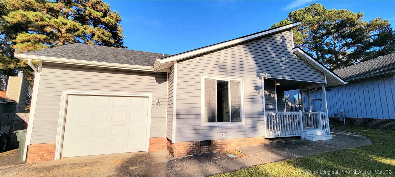 a front view of a house with a porch