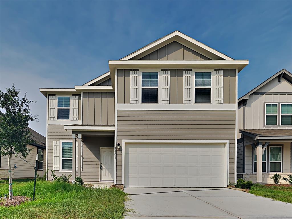 a front view of a house with garage