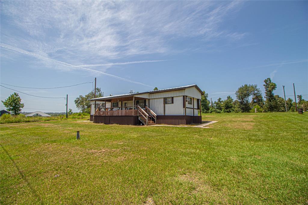 a house view with swimming pool in front of it