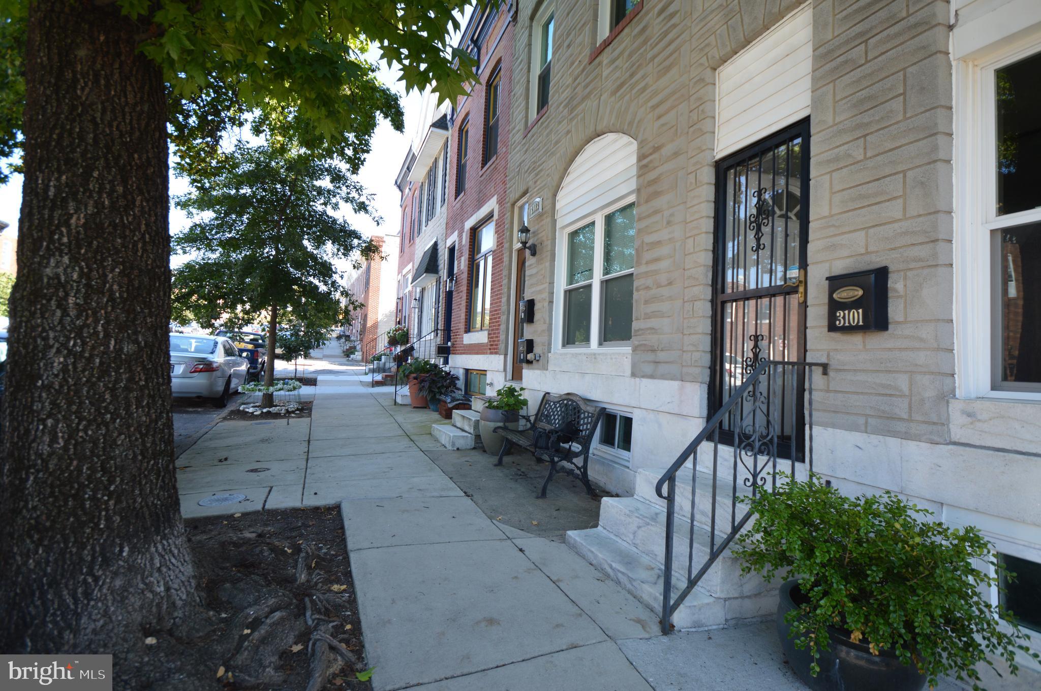 a view of a building with potted plants