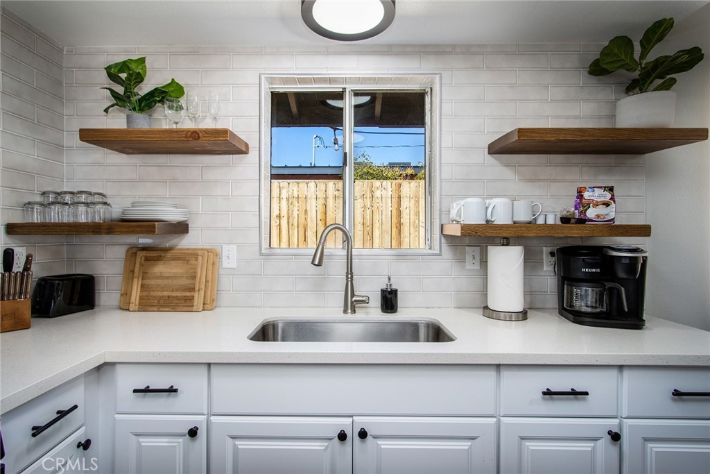 a kitchen with a sink and a cabinets