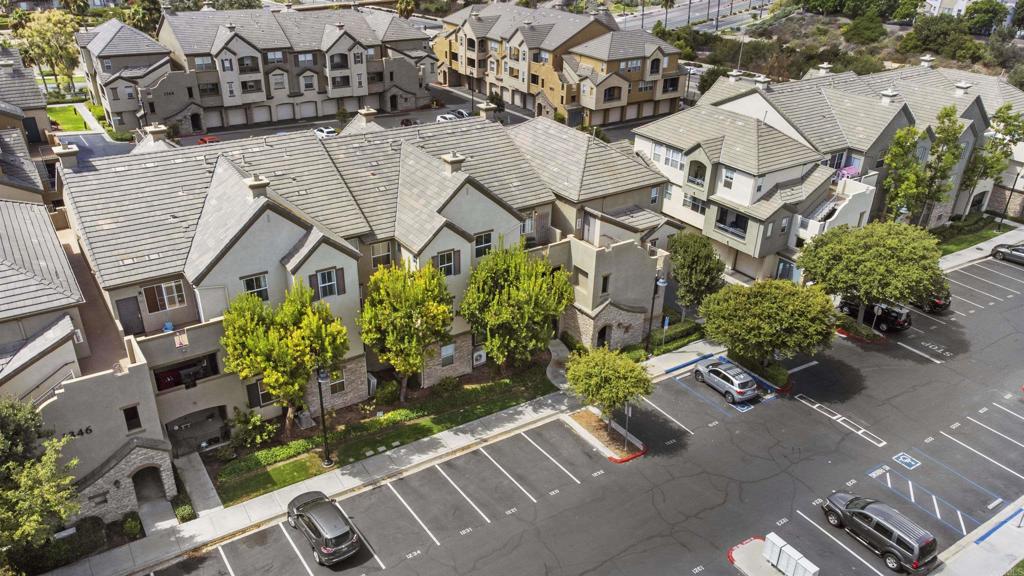 an aerial view of a house with a yard and outdoor seating