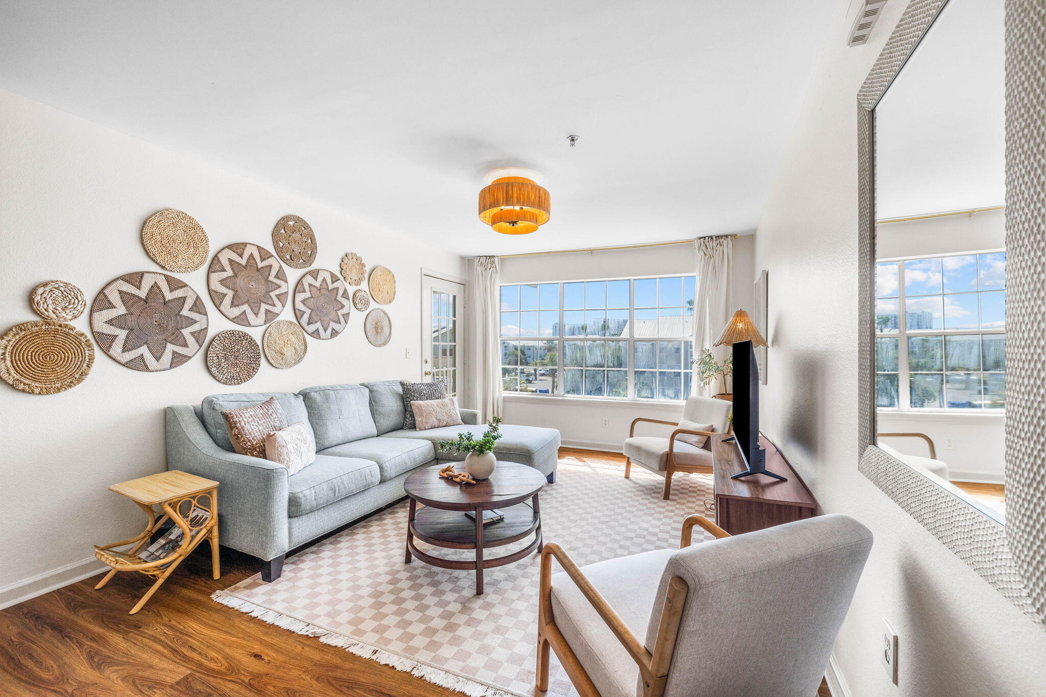 a living room with furniture and a large window