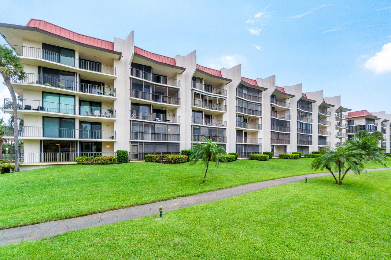 a view of a building with a yard