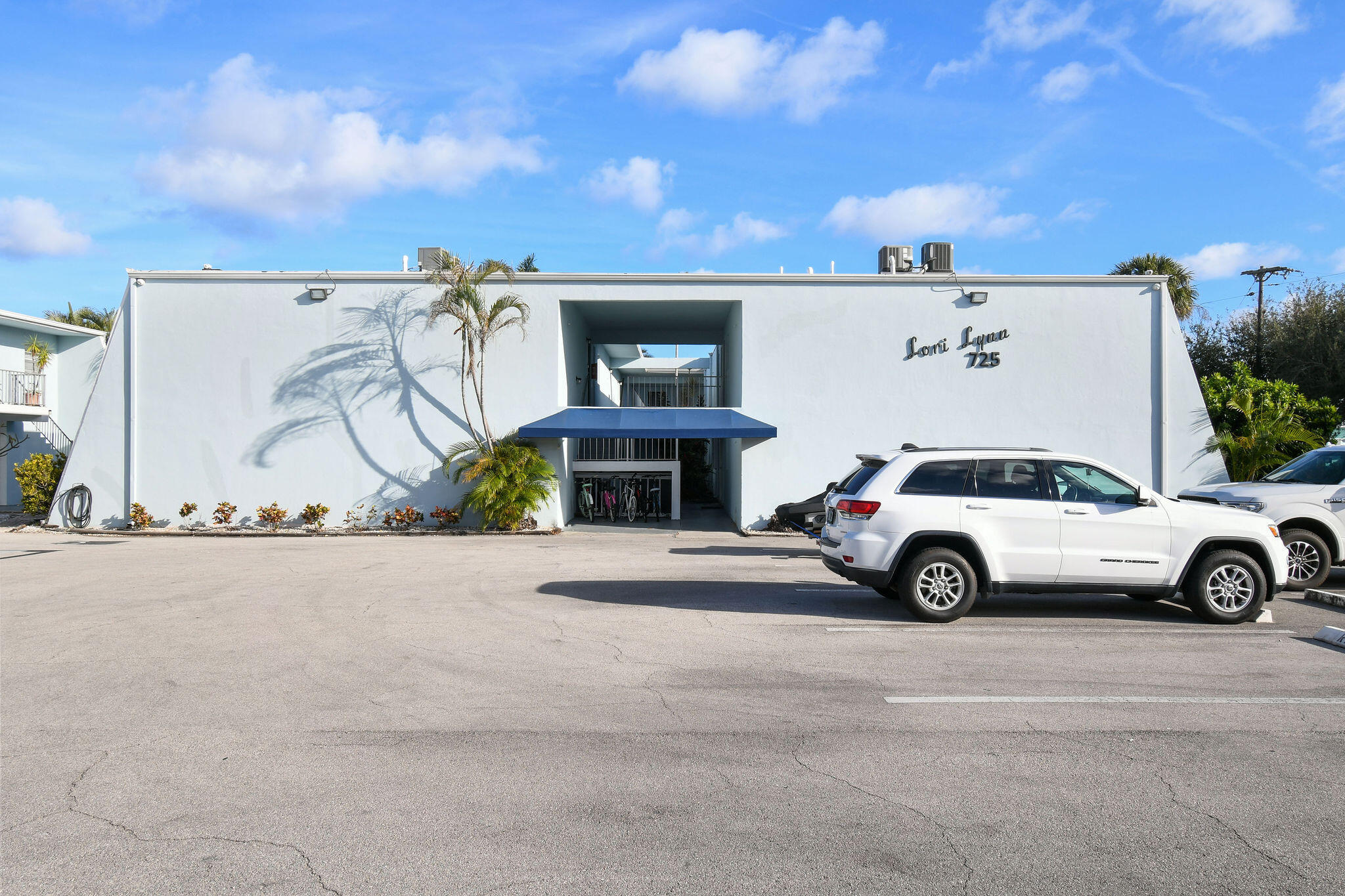 a view of a car in front of a building