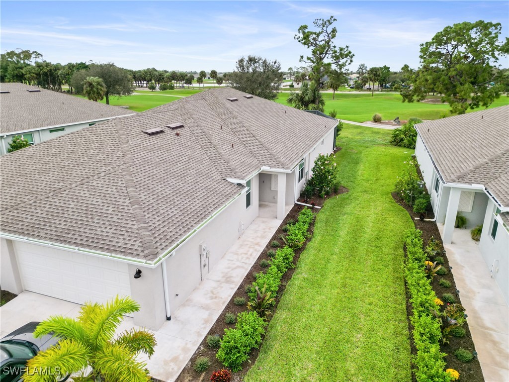 a aerial view of a house with a yard