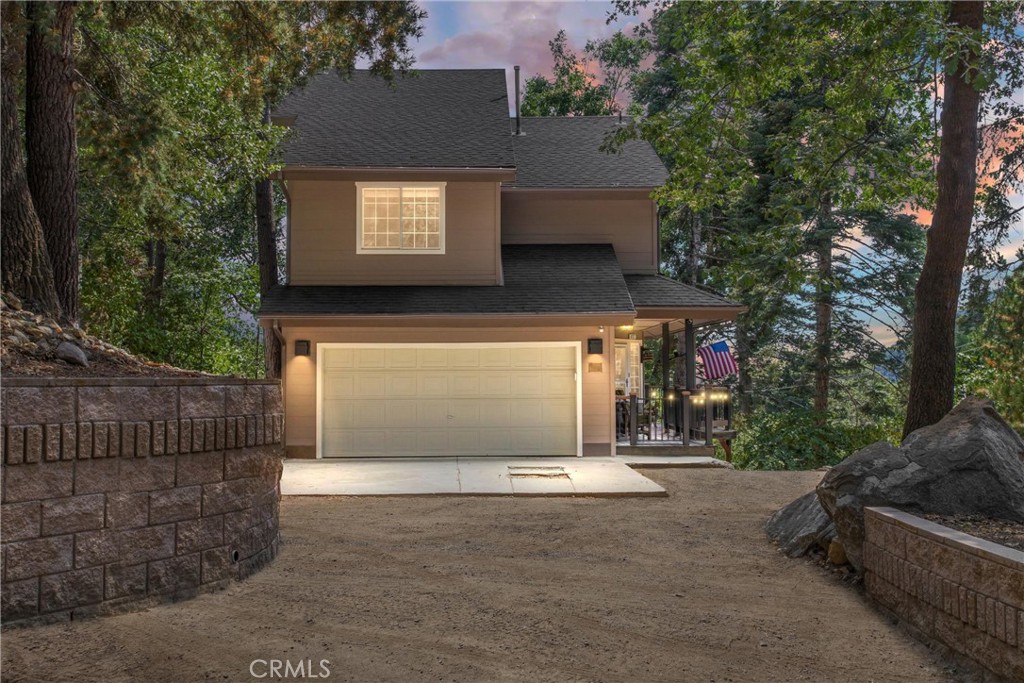 a front view of a house with a garage