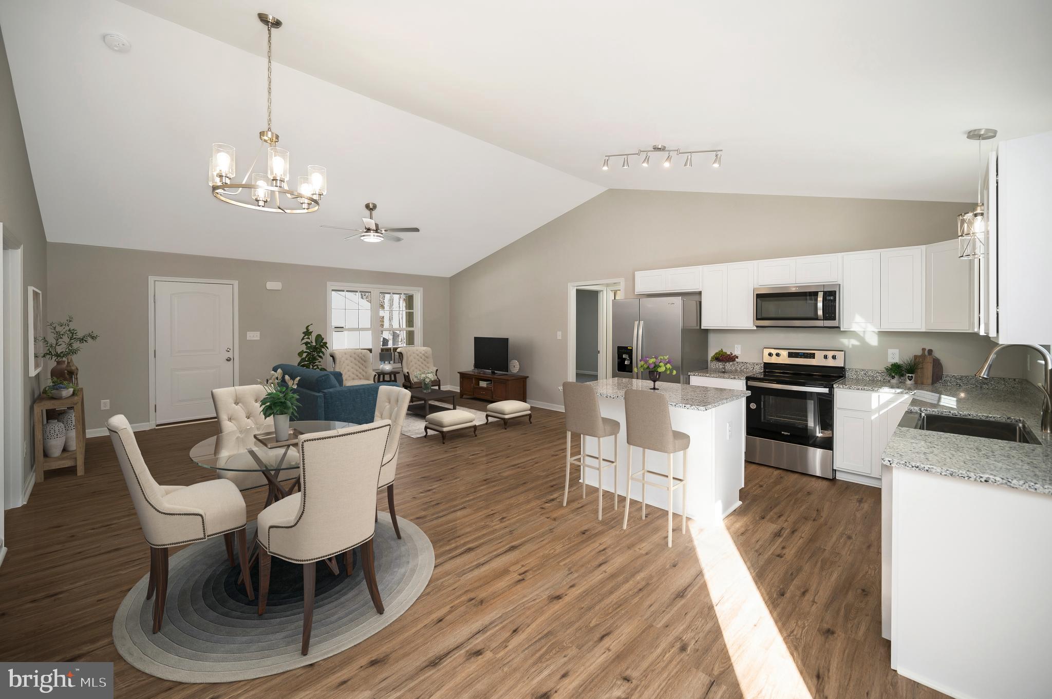 a view of a dining room with furniture kitchen and wooden floor