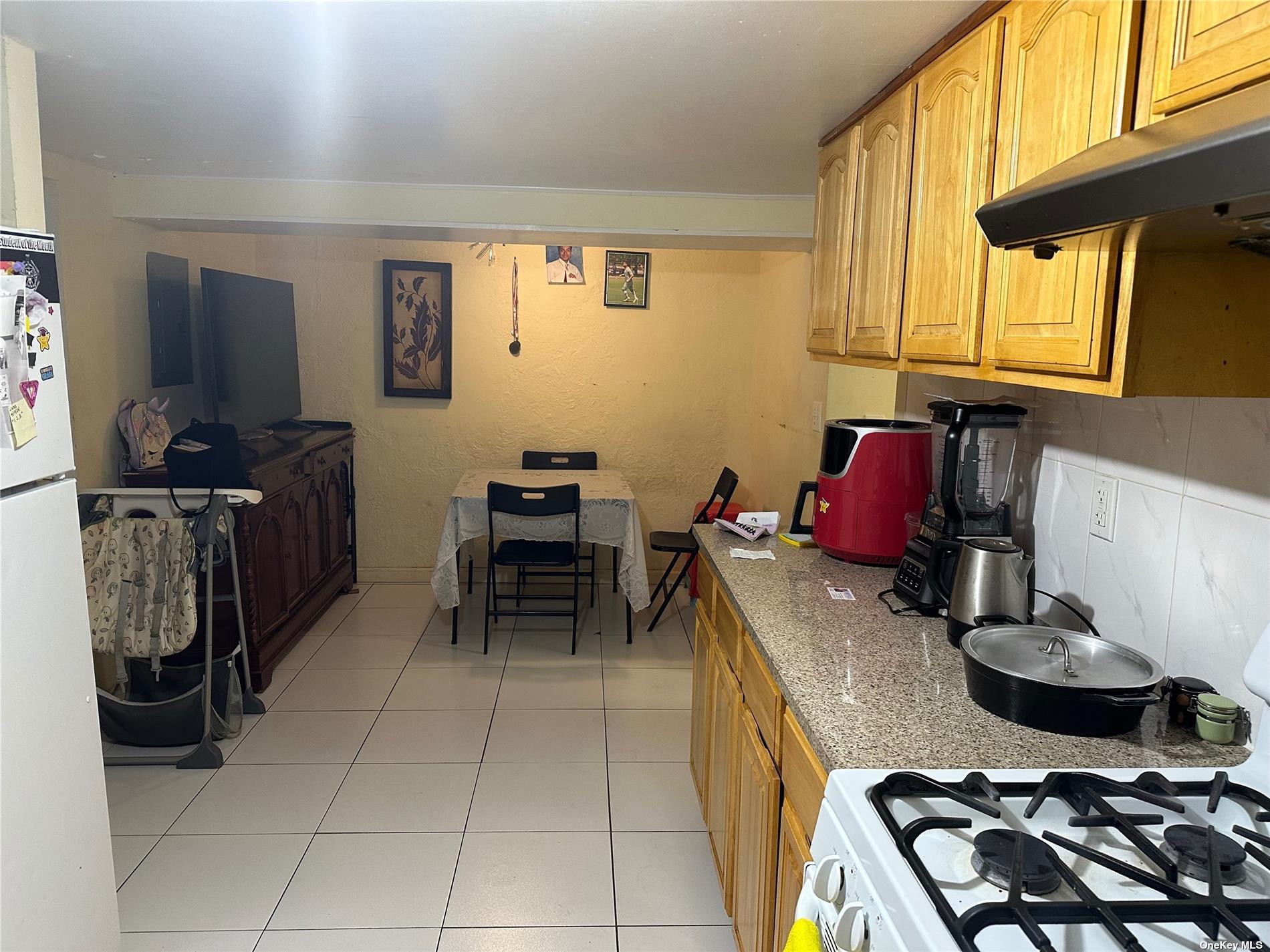 a kitchen with a stove and a microwave