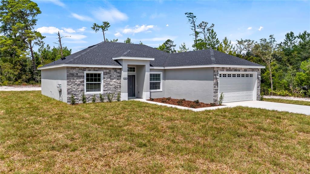 front view of a house with a yard