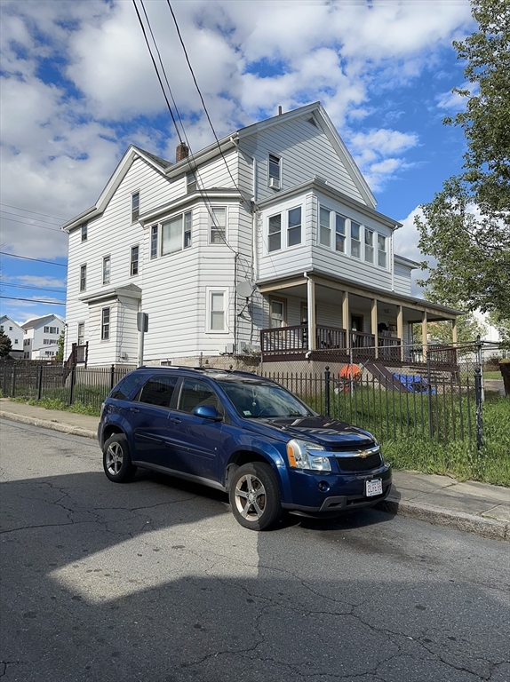 a car parked in front of a house