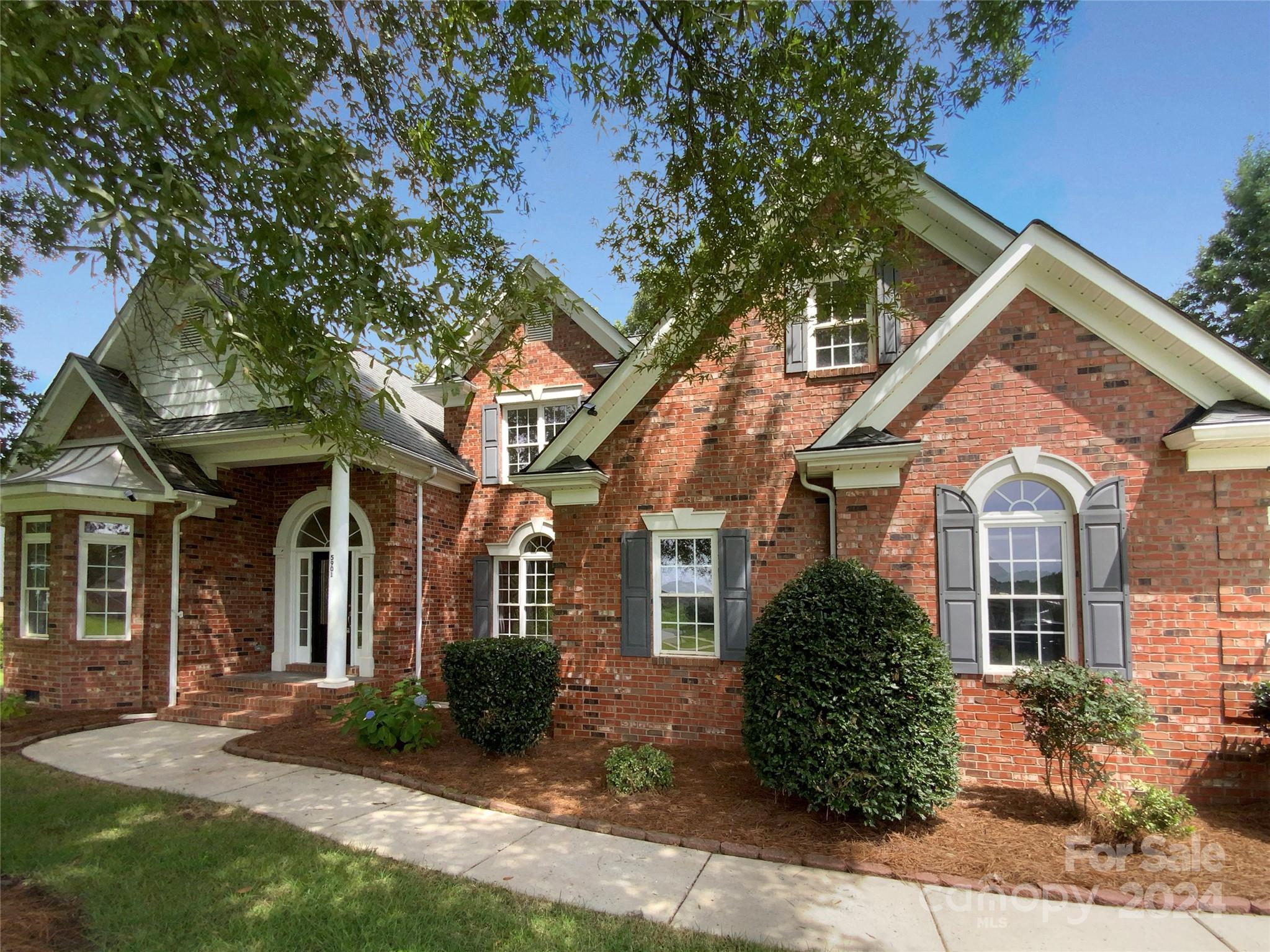 front view of a house with a yard