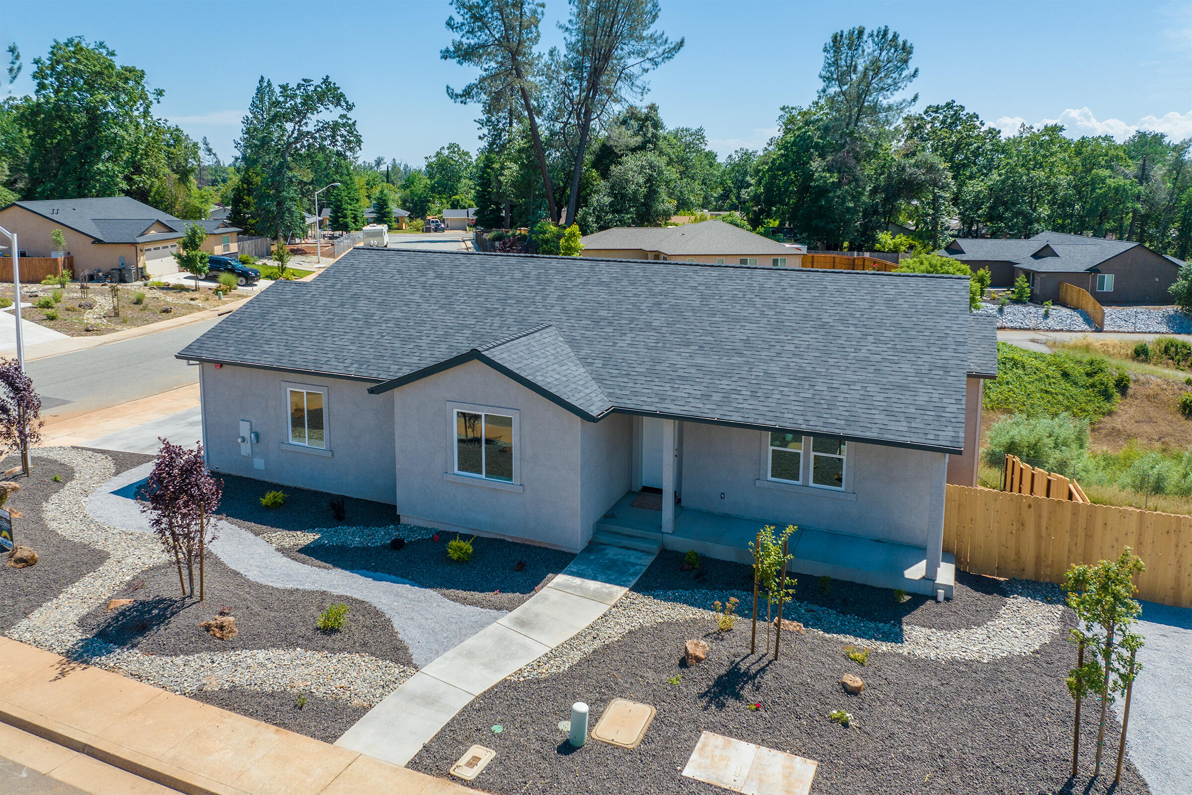 a aerial view of a house with a yard and sitting space