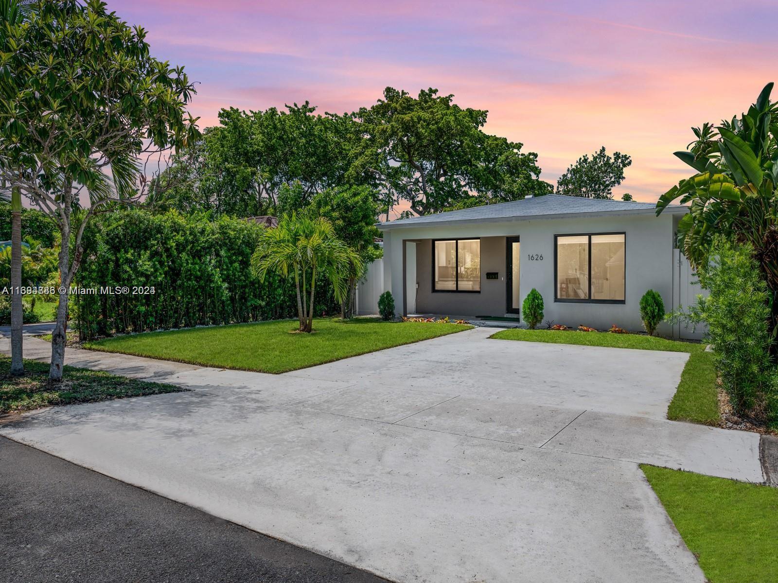 a house with yard in front of it