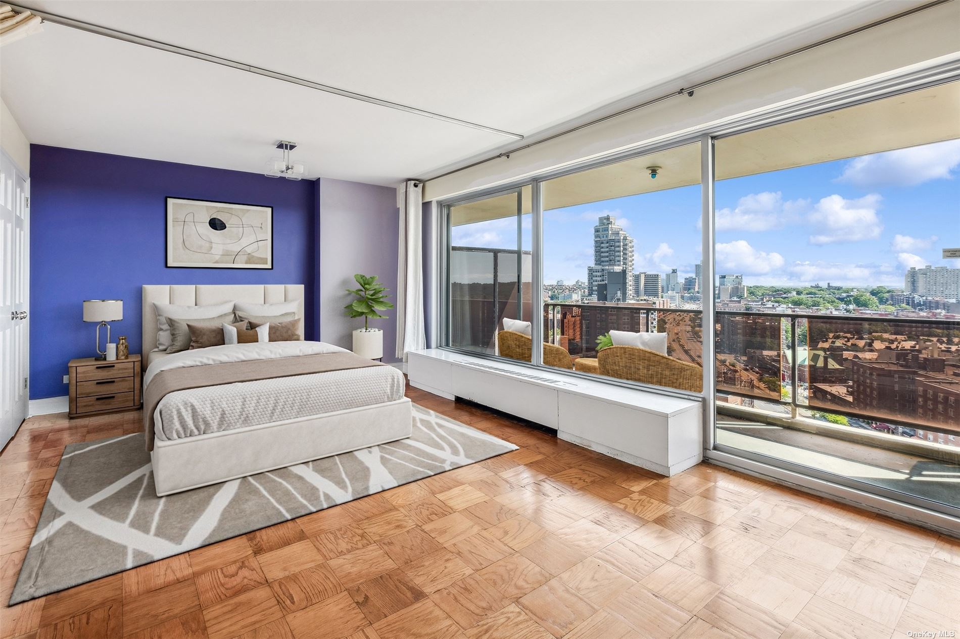 a bedroom with a large bed and a view of living room