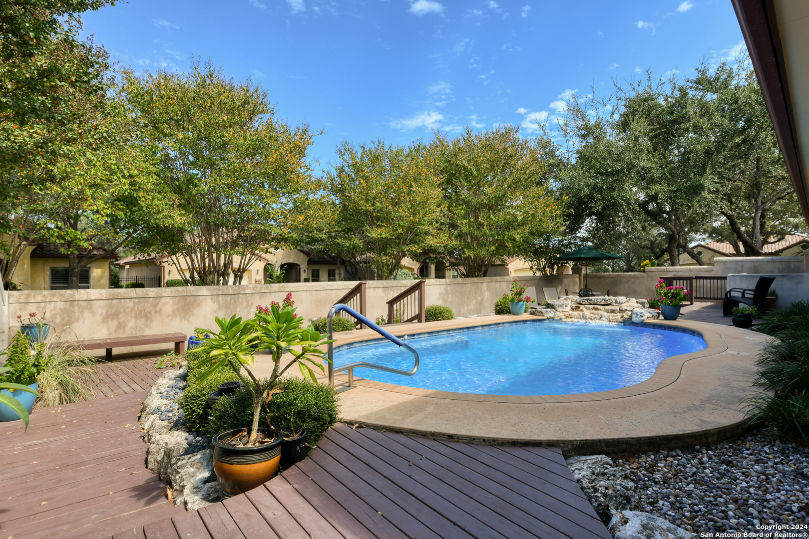 a view of a swimming pool with a patio