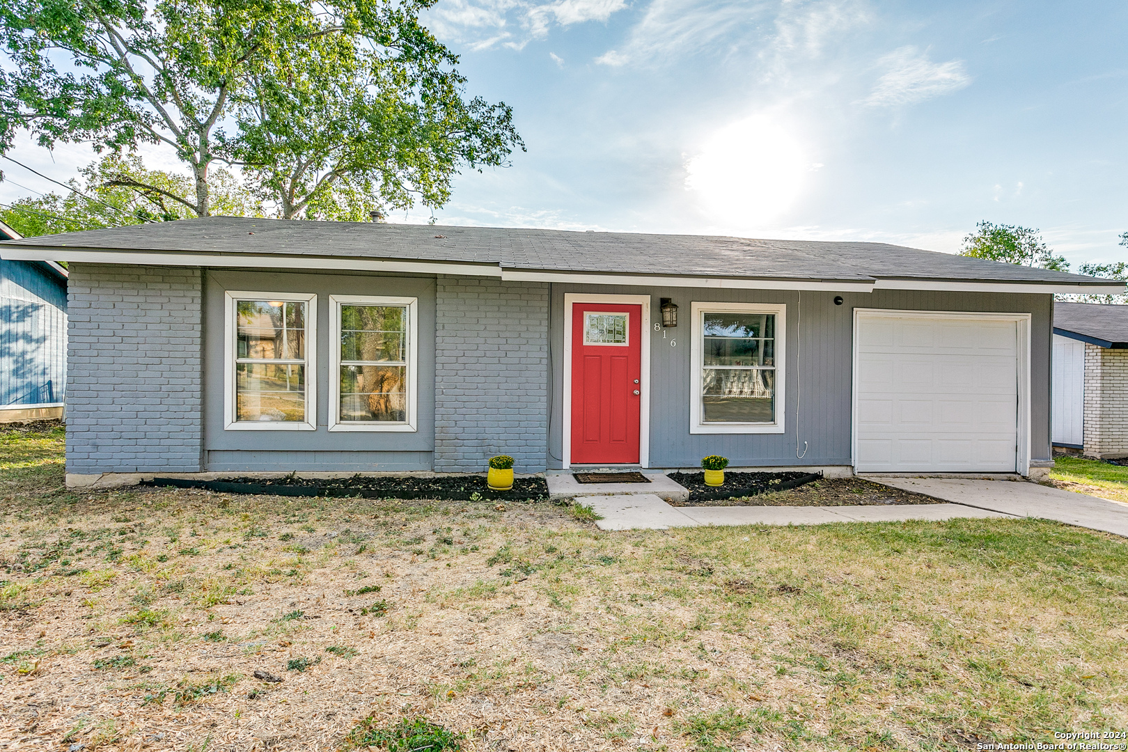 a view of front door and yard