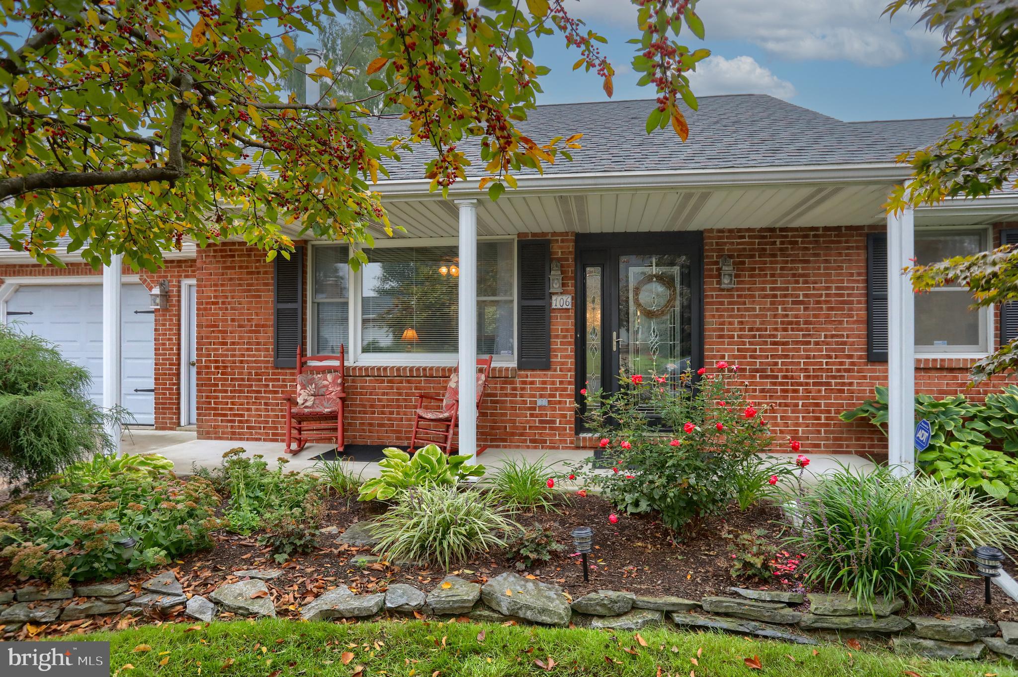 a front view of a house with garden