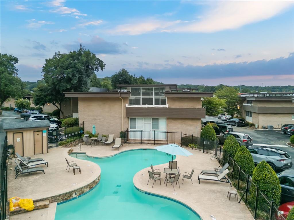 an aerial view of a house with garden and outdoor seating