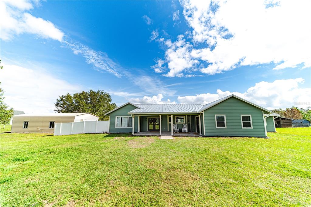 a view of a house with a big yard