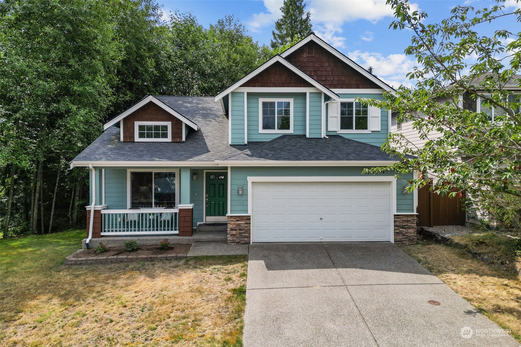 a front view of a house with garden