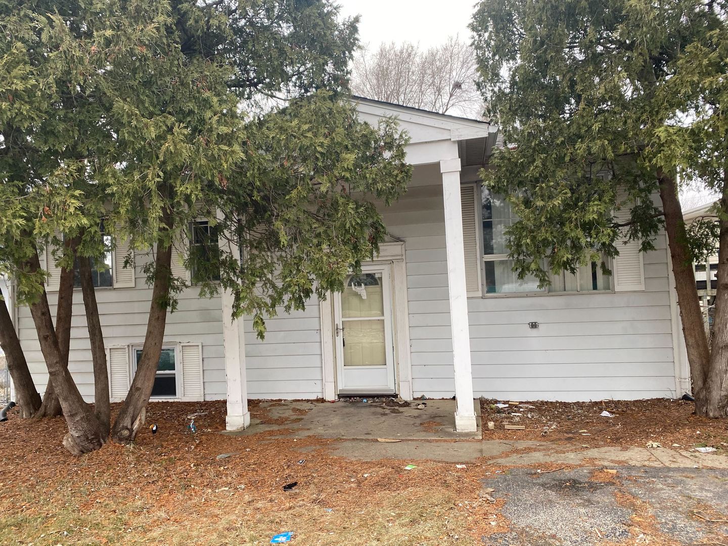 a house with a tree in the background