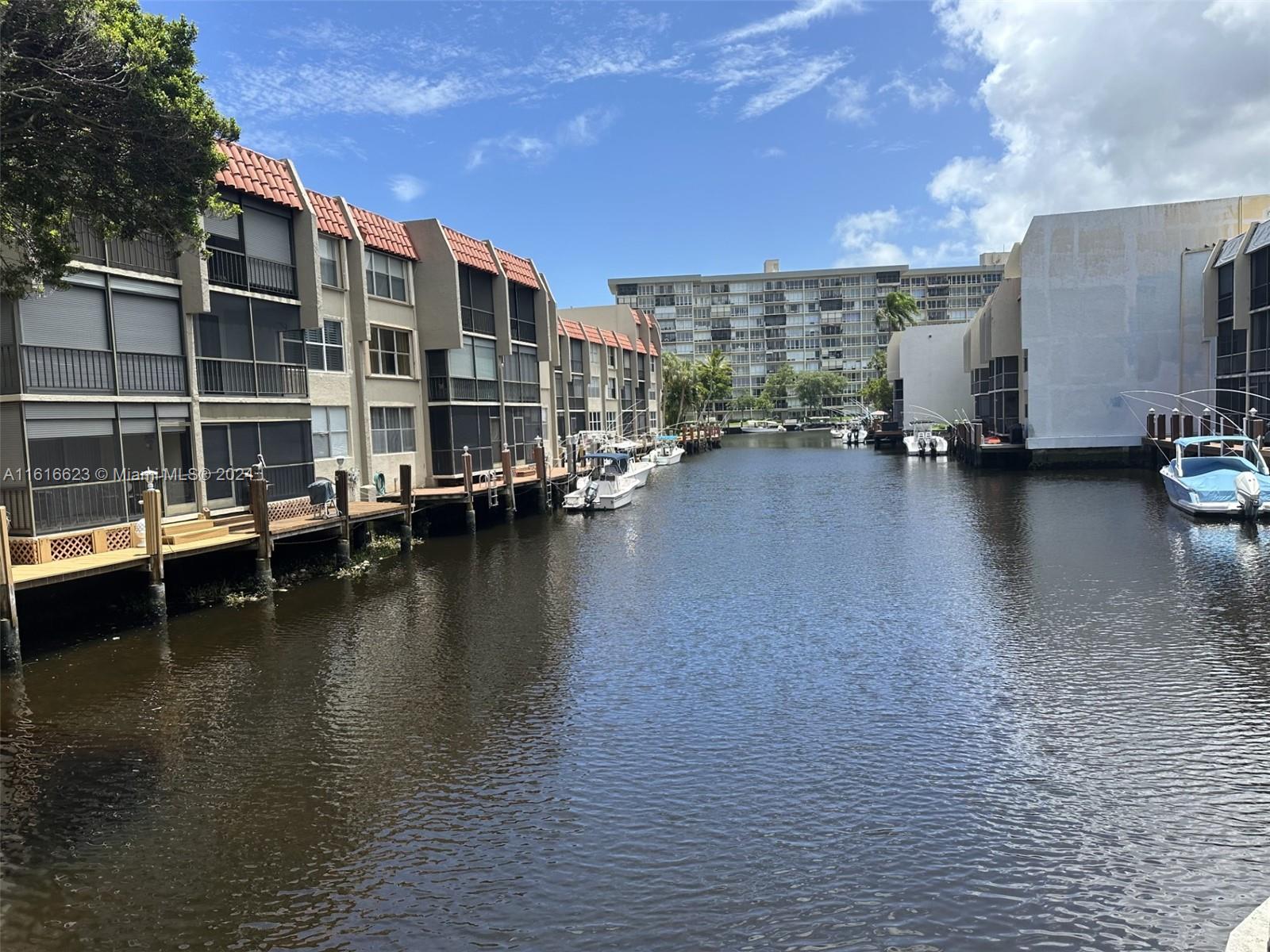 a view of a lake with building in front of it