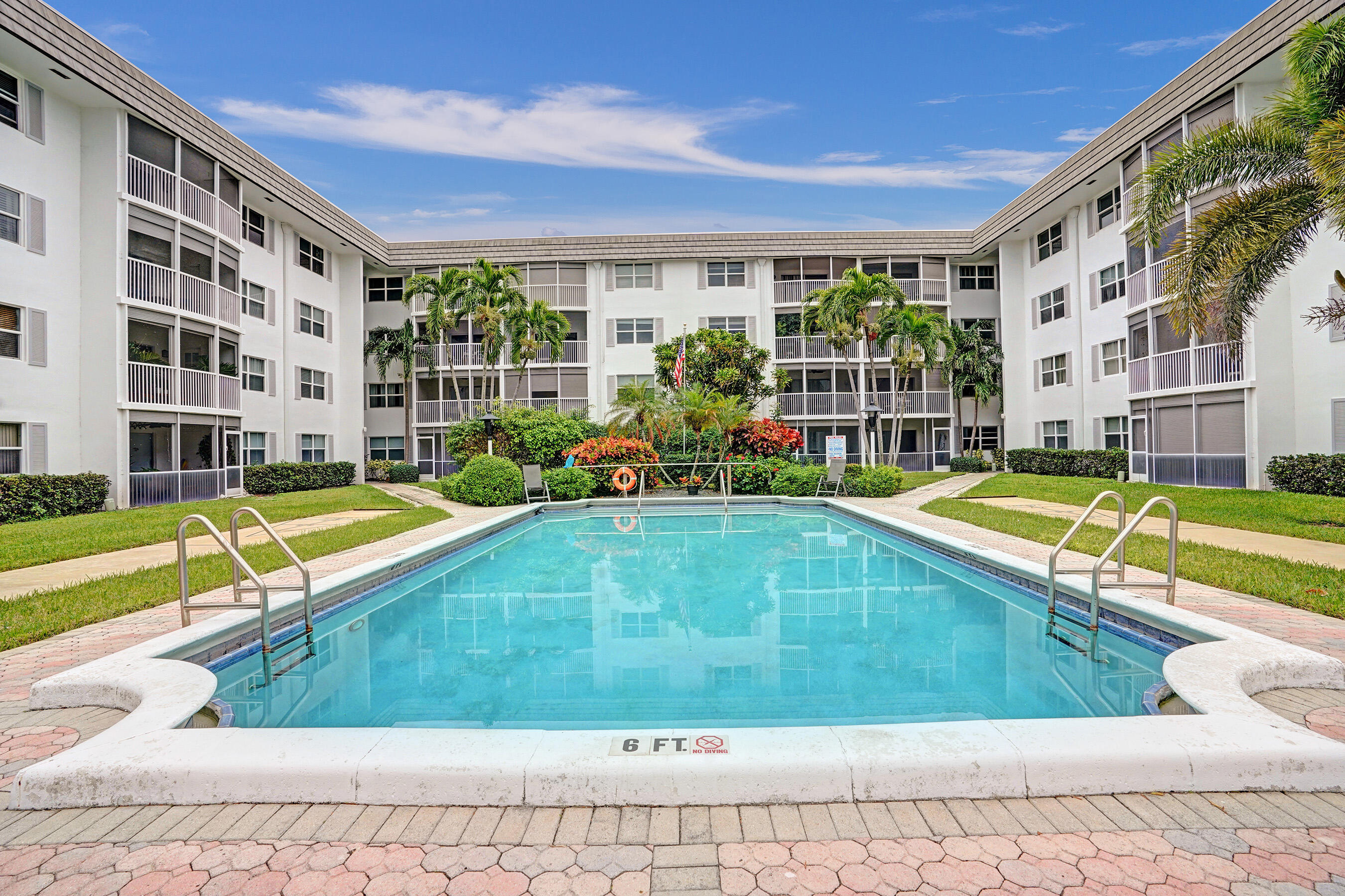 a view of swimming pool with outdoor seating