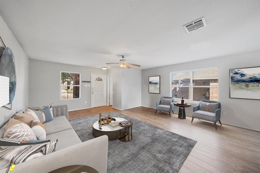 a living room with furniture and a table