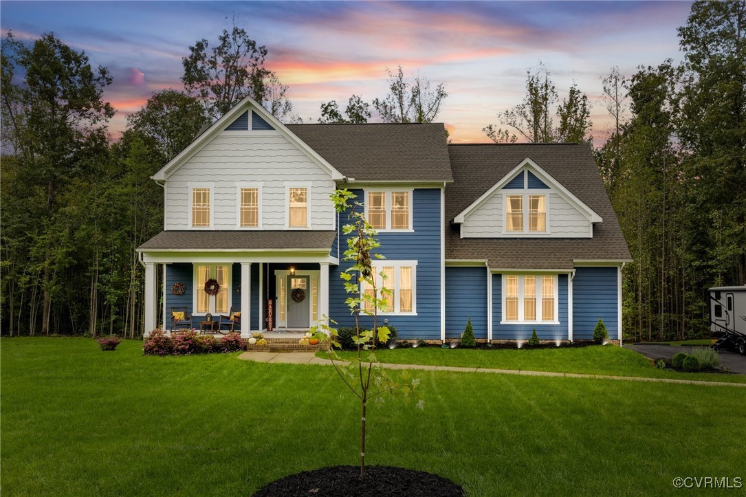 a front view of a house with a yard